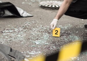 at-fault-car-insurance-connell-blog Officer at crash scene at-fault car insurance concept