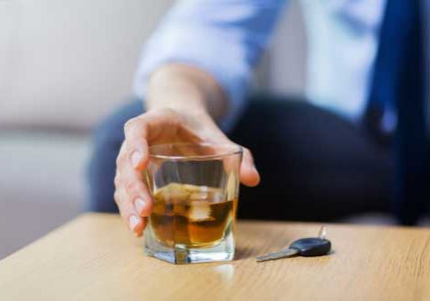 conell-law-firm-blog-one A man drinking a cup of alcohol.
